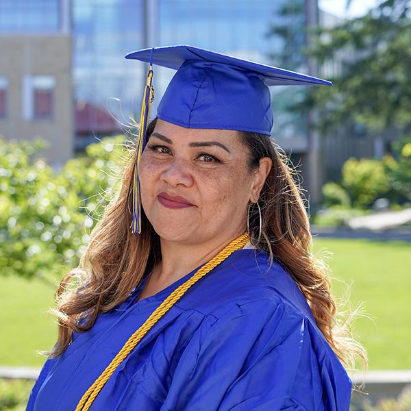 grad wearing blue regalia 